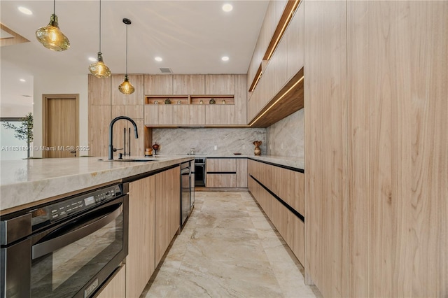 18269 SW 54th St, Miramar, FL 33029 - kitchen featuring modern cabinets, light brown cabinets, backsplash, black oven, and pendant lighting