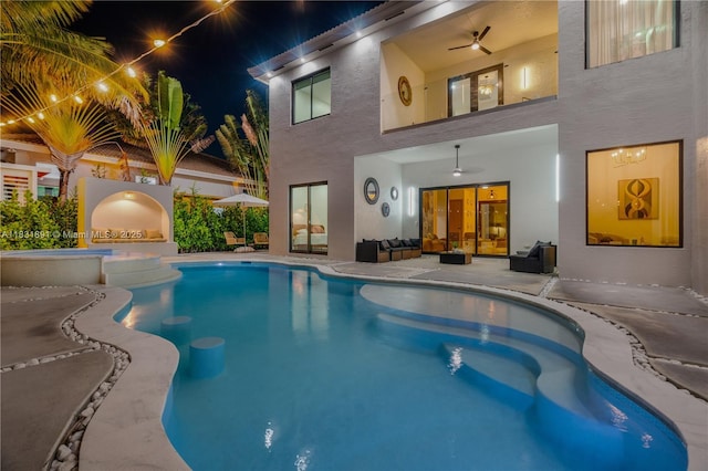 18269 SW 54th St, Miramar, FL 33029 - pool at night with an outdoor pool, ceiling fan, a patio area, and an outdoor hangout area