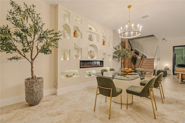 18269 SW 54th St, Miramar, FL 33029 - dining area with stairway, a chandelier, and a glass covered fireplace