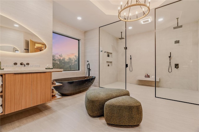 18269 SW 54th St, Miramar, FL 33029 - full bath featuring a freestanding tub, a walk in shower, vanity, wood finished floors, and a chandelier