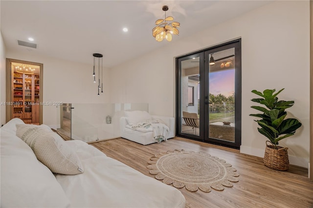18269 SW 54th St, Miramar, FL 33029 - bedroom featuring french doors, access to exterior, wood finished floors, a chandelier, and recessed lighting