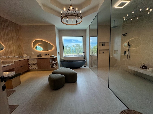 18269 SW 54th St, Miramar, FL 33029 - full bath with a walk in shower, a soaking tub, a chandelier, vanity, and wood finished floors