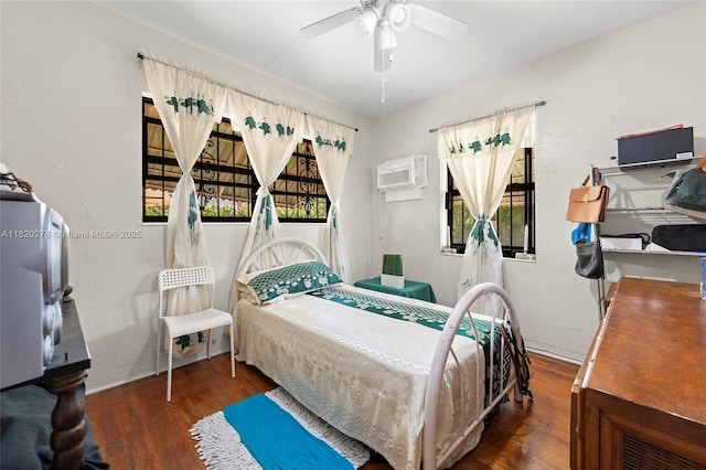 1430 NE 148th St, Miami, FL 33161 - bedroom with wood finished floors, a wall mounted AC, and a ceiling fan