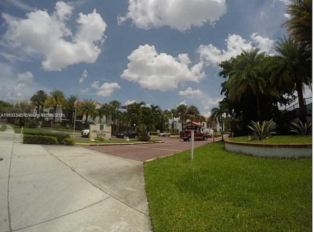 9421 Fontainebleau Blvd Unit 206-35, Miami, FL 33172 - surrounding community featuring a lawn