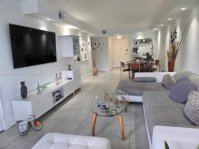1000 Parkview Dr Unit 114, Hallandale Beach, FL 33009 - living area featuring light tile patterned floors, recessed lighting, a raised ceiling, and ornamental molding