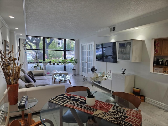 1000 Parkview Dr Unit 114, Hallandale Beach, FL 33009 - living room with light tile patterned floors, floor to ceiling windows, crown molding, a textured ceiling, and recessed lighting