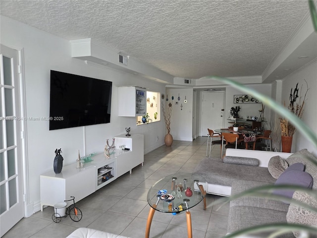 1000 Parkview Dr Unit 114, Hallandale Beach, FL 33009 - living area featuring light tile patterned floors and a textured ceiling