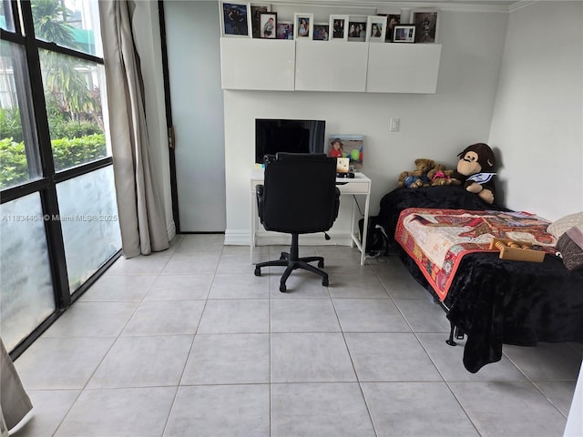 1000 Parkview Dr Unit 114, Hallandale Beach, FL 33009 - bedroom with multiple windows, light tile patterned floors, crown molding, and an office area