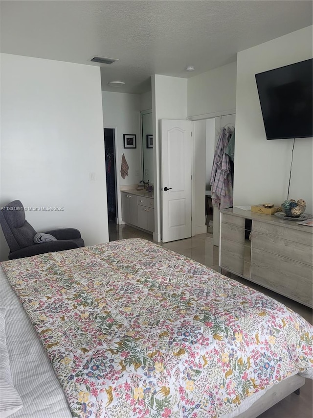 16909 SW 141st Ct, Miami, FL 33177 - bedroom with a closet and a textured ceiling