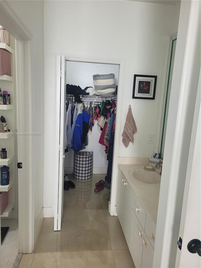 16909 SW 141st Ct, Miami, FL 33177 - bathroom featuring vanity, a spacious closet, and tile patterned flooring