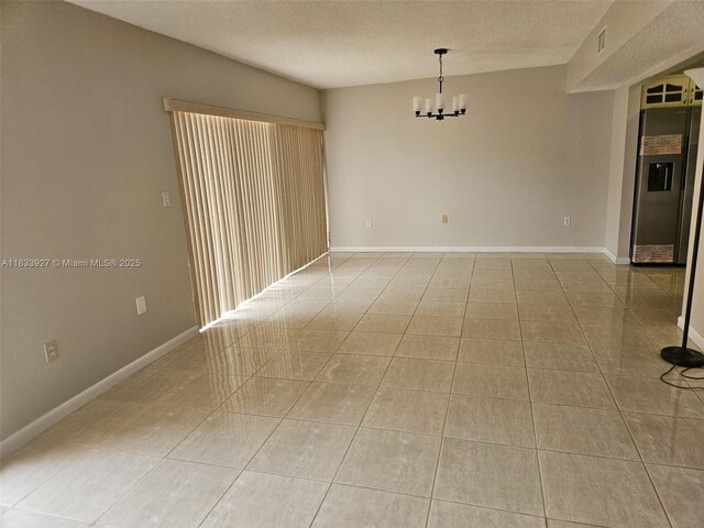 9199 Fontainebleau Blvd Unit 6, Miami, FL 33172 - unfurnished room with light tile patterned floors, a chandelier, and a textured ceiling