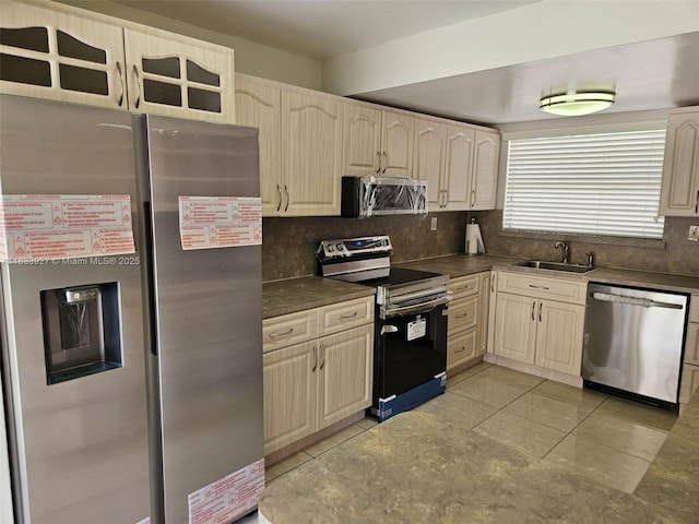 9199 Fontainebleau Blvd Unit 6, Miami, FL 33172 - kitchen featuring stainless steel appliances, dark countertops, backsplash, and light tile patterned floors
