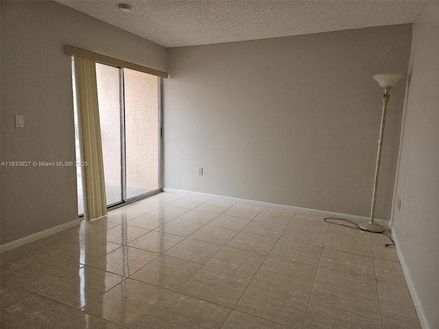 9199 Fontainebleau Blvd Unit 6, Miami, FL 33172 - tiled spare room featuring a textured ceiling and a smoke detector