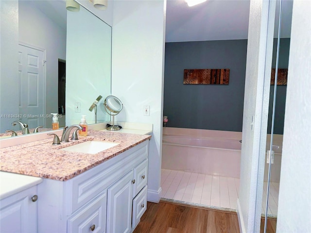 11405 Lakeview Dr Unit 3-A, Coral Springs, FL 33071 - bathroom with vanity, wood finished floors, and a bath