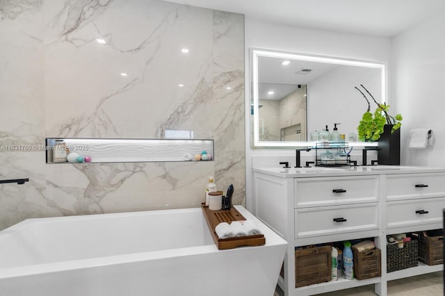 4000 NE 168th St Unit 113B, North Miami Beach, FL 33160 - full bathroom with a freestanding tub and vanity