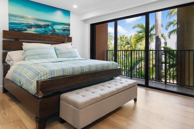 4000 NE 168th St Unit 113B, North Miami Beach, FL 33160 - bedroom featuring access to outside, wood finished floors, and recessed lighting