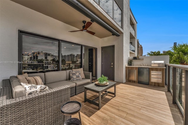 4000 NE 168th St Unit 113B, North Miami Beach, FL 33160 - wooden terrace with an outdoor hangout area, an outdoor kitchen, and a ceiling fan