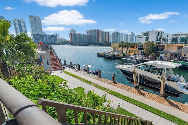 4000 NE 168th St Unit 113B, North Miami Beach, FL 33160 - dock featuring a water view, a skyline view, and boat lift