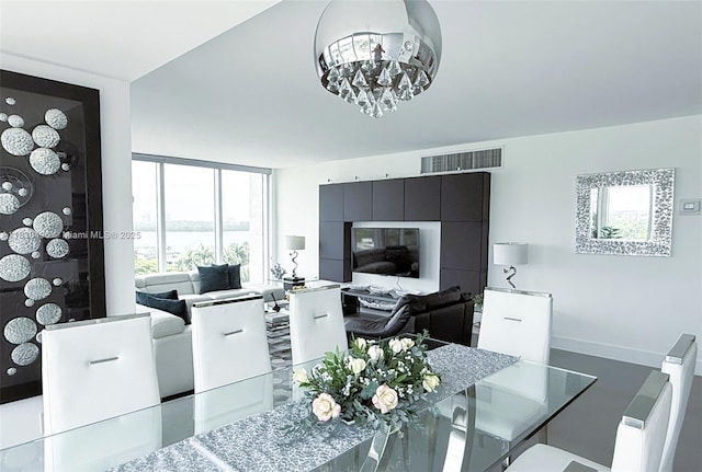 10275 Collins Ave Unit 722, Bal Harbour, FL 33154 - dining room featuring a chandelier