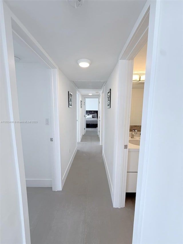 10275 Collins Ave Unit 722, Bal Harbour, FL 33154 - corridor with finished concrete flooring and baseboards