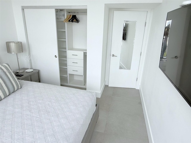 10275 Collins Ave Unit 722, Bal Harbour, FL 33154 - bedroom featuring baseboards and a closet
