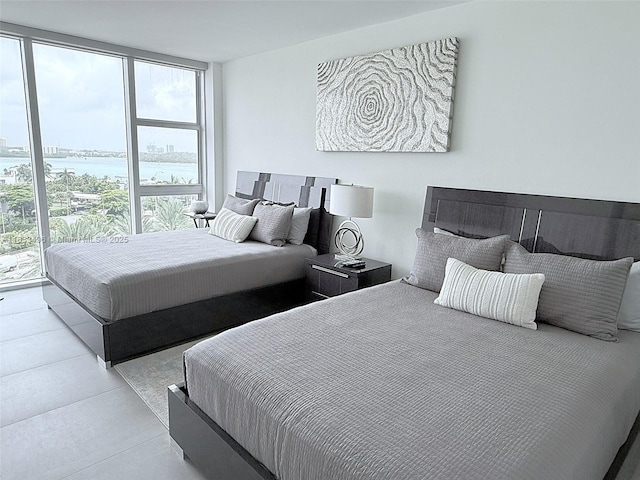 10275 Collins Ave Unit 722, Bal Harbour, FL 33154 - bedroom with multiple windows, floor to ceiling windows, and a water view