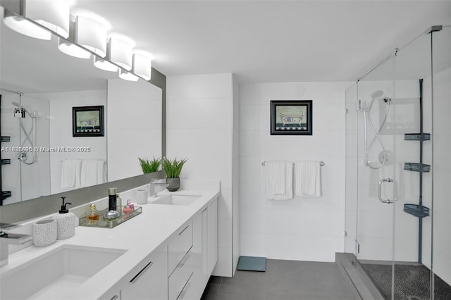 10275 Collins Ave Unit 722, Bal Harbour, FL 33154 - bathroom featuring double vanity, a shower stall, and tile patterned floors