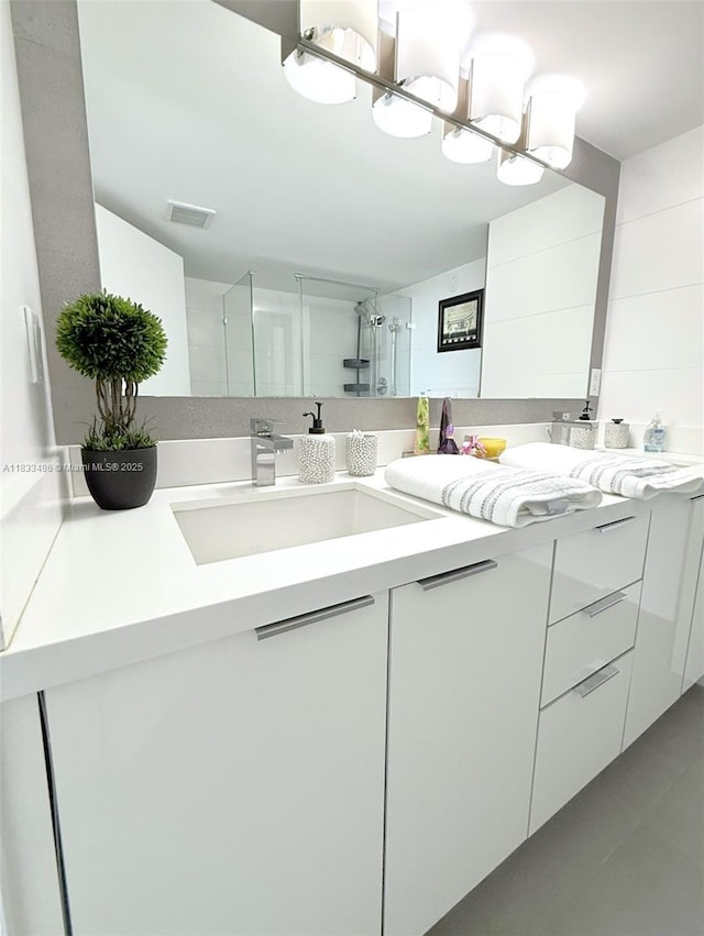 10275 Collins Ave Unit 722, Bal Harbour, FL 33154 - full bath with double vanity, tile patterned flooring, and a shower