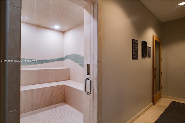 10275 Collins Ave Unit 722, Bal Harbour, FL 33154 - bathroom with elevator, tile patterned floors, a stall shower, and recessed lighting