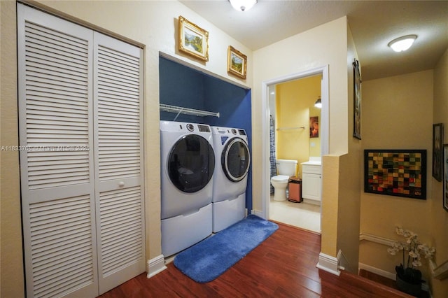3335 Palomino Dr, Davie, FL 33024 - washroom with separate washer and dryer and dark wood-style flooring