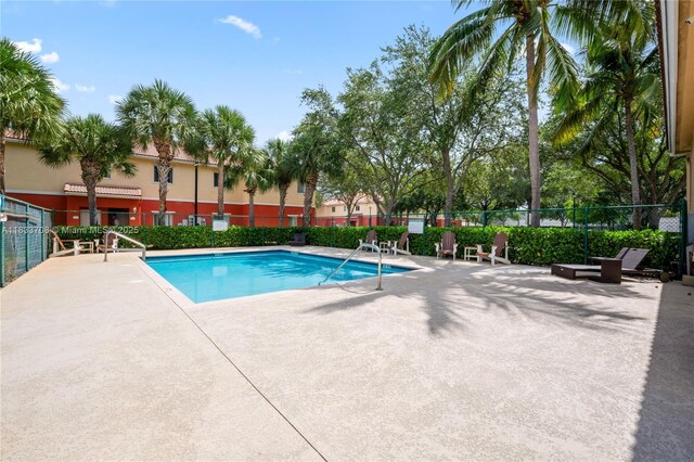 3335 Palomino Dr, Davie, FL 33024 - community pool with a patio area