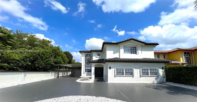 9017 SW 157th Path, Miami, FL 33196 - view of front facade featuring stucco siding, driveway, a tiled roof, and an attached carport
