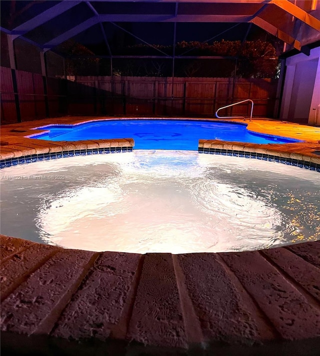 9017 SW 157th Path, Miami, FL 33196 - view of swimming pool with a fenced backyard, a lanai, and a pool with connected hot tub