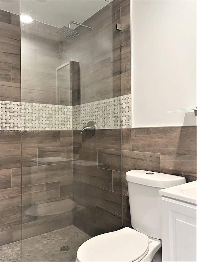9017 SW 157th Path, Miami, FL 33196 - bathroom featuring vanity, a walk in shower, and tile walls