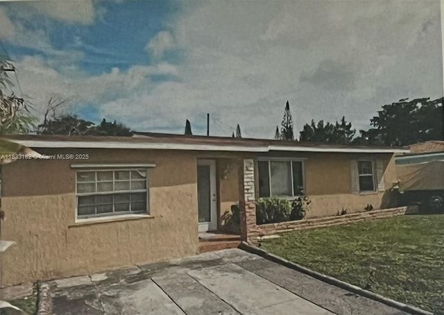 12625 NW 1st Ct, North Miami, FL 33168 - view of front facade featuring stucco siding