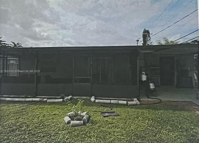 12625 NW 1st Ct, North Miami, FL 33168 - view of green lawn with a sunroom