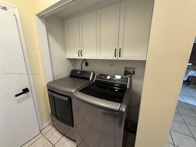 1851 SW 101st Way, Miramar, FL 33025 - laundry room featuring light tile patterned flooring, cabinet space, and washing machine and clothes dryer