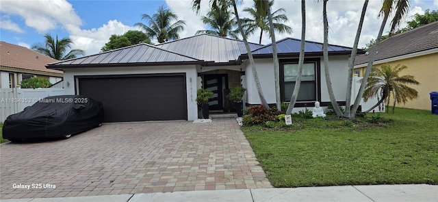 19185 SW 25th Ct, Miramar, FL 33029 - ranch-style home featuring a garage, stucco siding, decorative driveway, and a metal roof