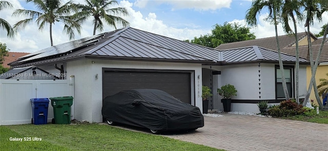 19185 SW 25th Ct, Miramar, FL 33029 - view of home's exterior featuring decorative driveway, a garage, a standing seam roof, stucco siding, and a metal roof