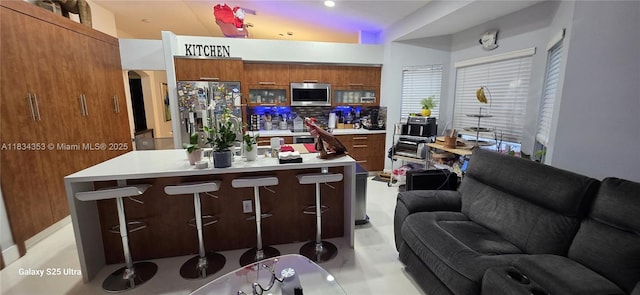 19185 SW 25th Ct, Miramar, FL 33029 - kitchen with stainless steel appliances, brown cabinets, light countertops, modern cabinets, and tasteful backsplash