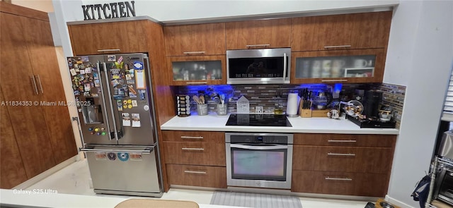 19185 SW 25th Ct, Miramar, FL 33029 - kitchen with stainless steel appliances, modern cabinets, tasteful backsplash, and light countertops