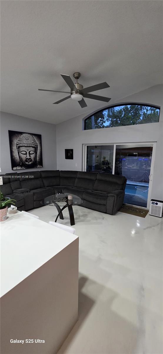 19185 SW 25th Ct, Miramar, FL 33029 - living area with a ceiling fan and vaulted ceiling