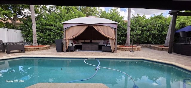 19185 SW 25th Ct, Miramar, FL 33029 - outdoor pool with an outdoor living space, a patio, and a fenced backyard