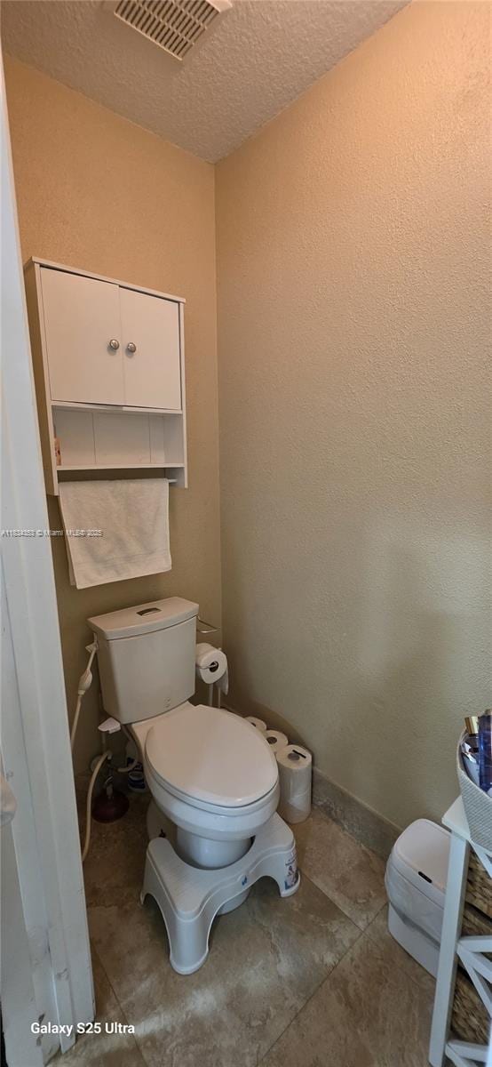19185 SW 25th Ct, Miramar, FL 33029 - bathroom with toilet and a textured ceiling
