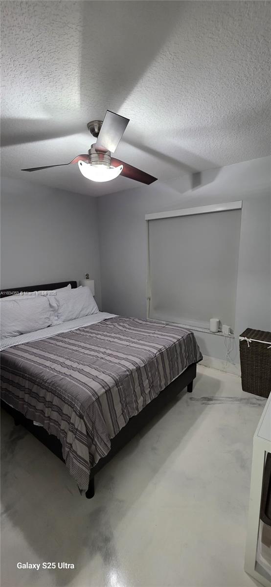 19185 SW 25th Ct, Miramar, FL 33029 - bedroom with a textured ceiling and a ceiling fan