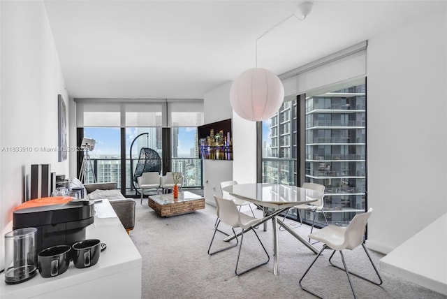 501 NE 31st St Unit 2308, Miami, FL 33137 - dining room featuring carpet floors, a wall of windows, and a view of city