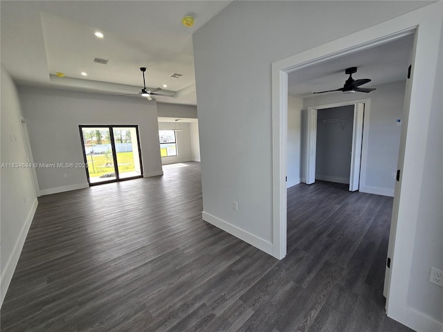 1605 W 11th St, Lehigh Acres, FL 33971 - unfurnished room with a ceiling fan, dark wood-style flooring, recessed lighting, a raised ceiling, and a smoke detector