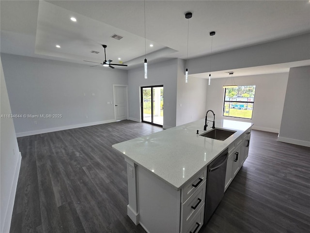 1605 W 11th St, Lehigh Acres, FL 33971 - kitchen featuring stainless steel dishwasher, a raised ceiling, dark wood finished floors, pendant lighting, and recessed lighting