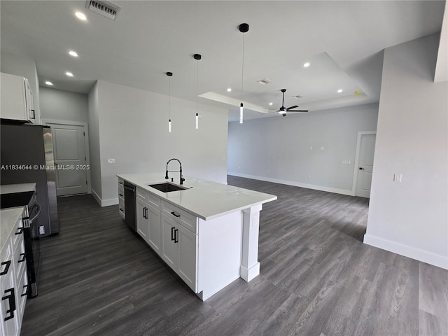1605 W 11th St, Lehigh Acres, FL 33971 - kitchen featuring stainless steel electric range oven, ceiling fan, white cabinets, recessed lighting, and dark wood-style flooring