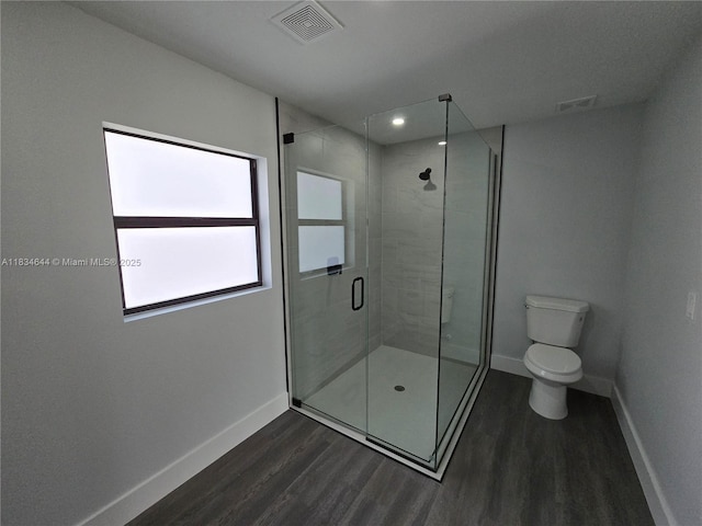 1605 W 11th St, Lehigh Acres, FL 33971 - bathroom with wood finished floors, a stall shower, and recessed lighting